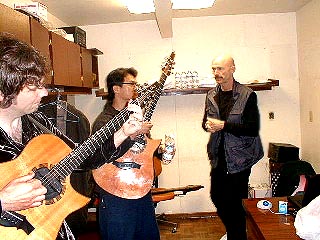 Paul and Hideyo tune up as Tony looks on.