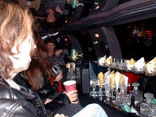 Paul looks over the bar onboard the limo.