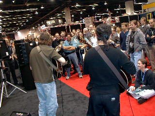 The Trio working their booth at the NAMM festival.